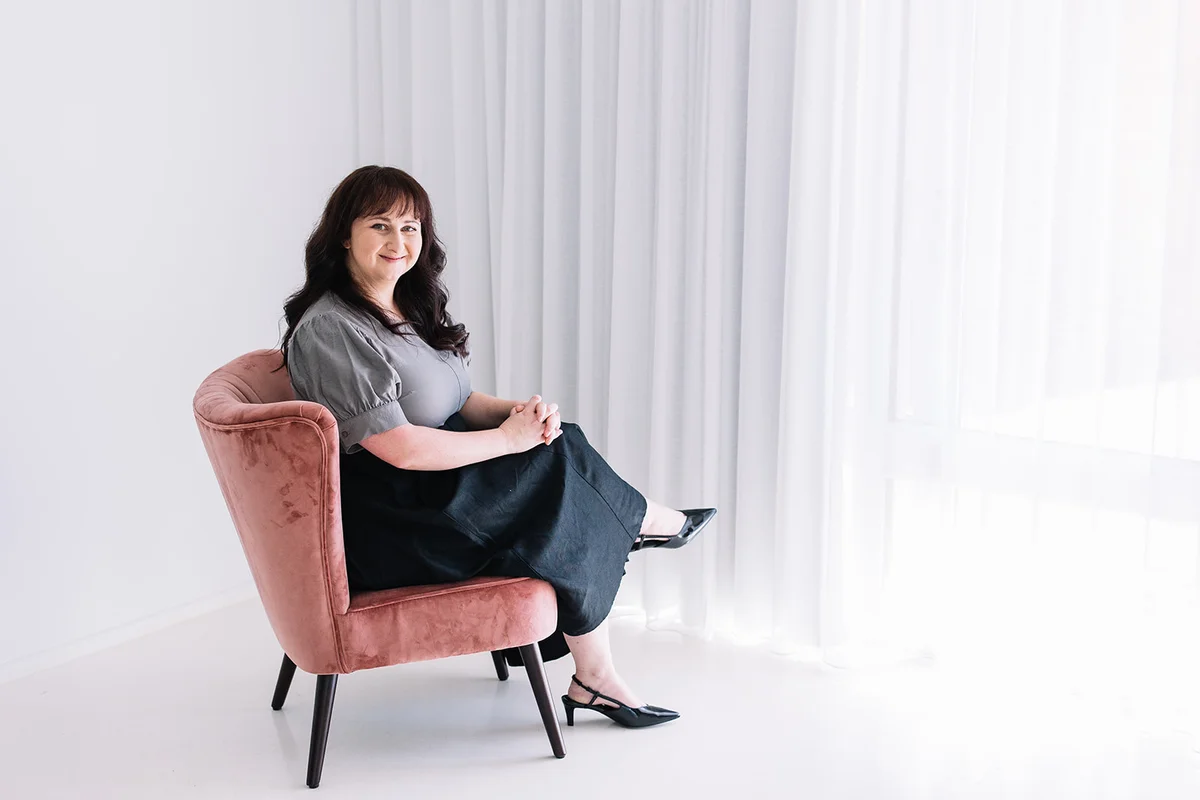 Zoe Semmler in a therapy session - demonstrating warm, empathetic, and professional approach to psychology practice